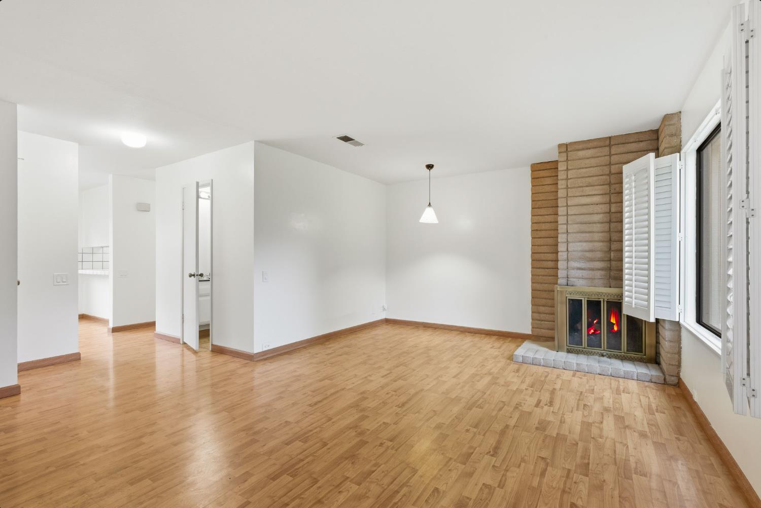 524 Hartnell Place Sacramento, CA 95825 - Photo 5 of 25 wooden floor in an empty room with a window