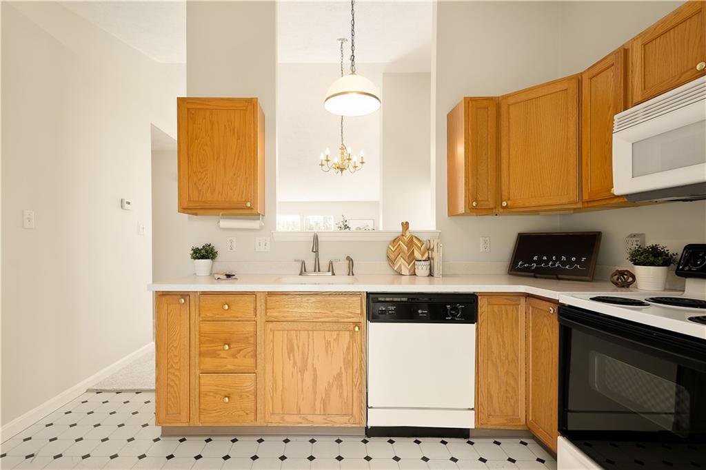 146 Sedeca Drive Canonsburg, PA 15317 - Photo 18 of 41 a kitchen with stainless steel appliances a sink a stove a microwave and cabinets