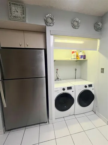 a bedroom with furniture and a large window