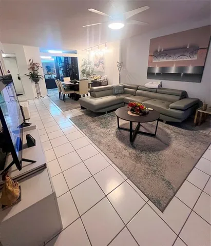 a lobby with furniture and a potted plant