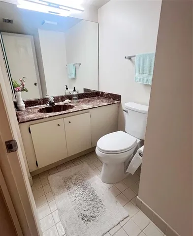 a kitchen with stainless steel appliances granite countertop a sink and a stove
