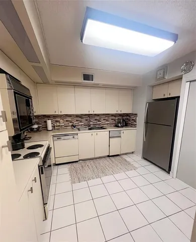 a view of storage and utility room with washer and dryer