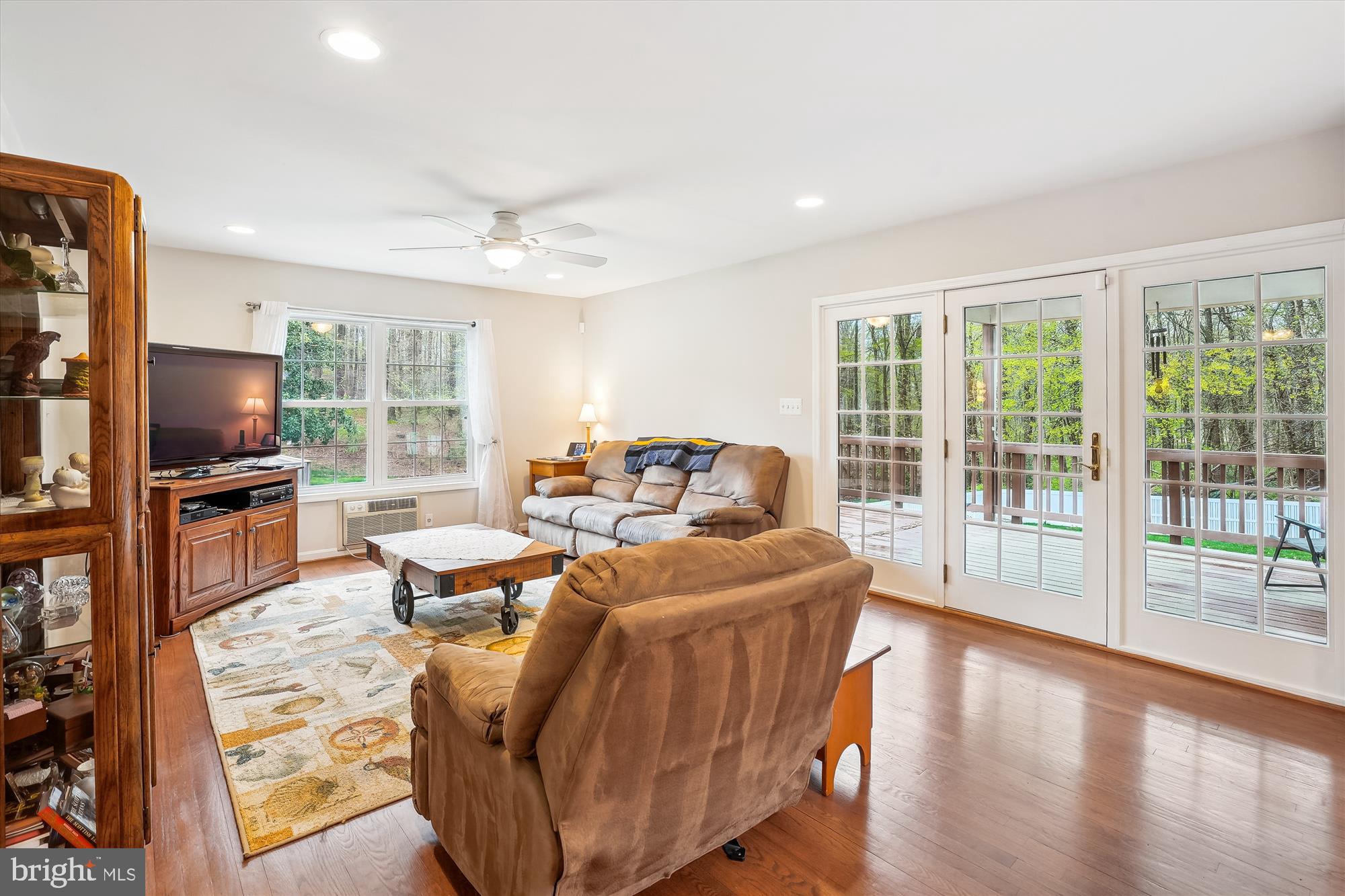 6957 Conservation Drive Springfield, VA 22153 - Photo 11 of 64 a living room with furniture tv and a large window