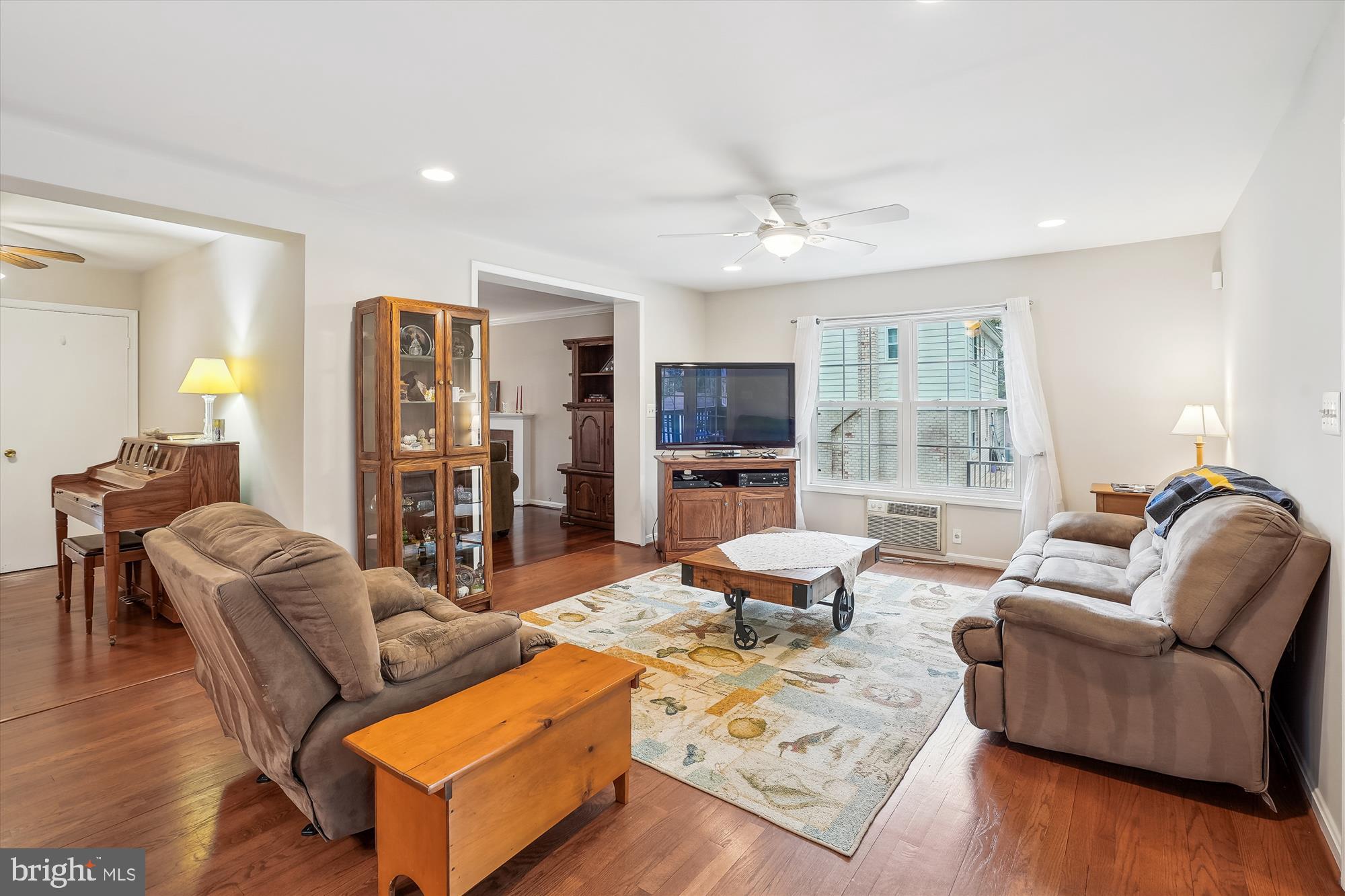 6957 Conservation Drive Springfield, VA 22153 - Photo 12 of 64 a living room with furniture flat screen tv and wooden floor