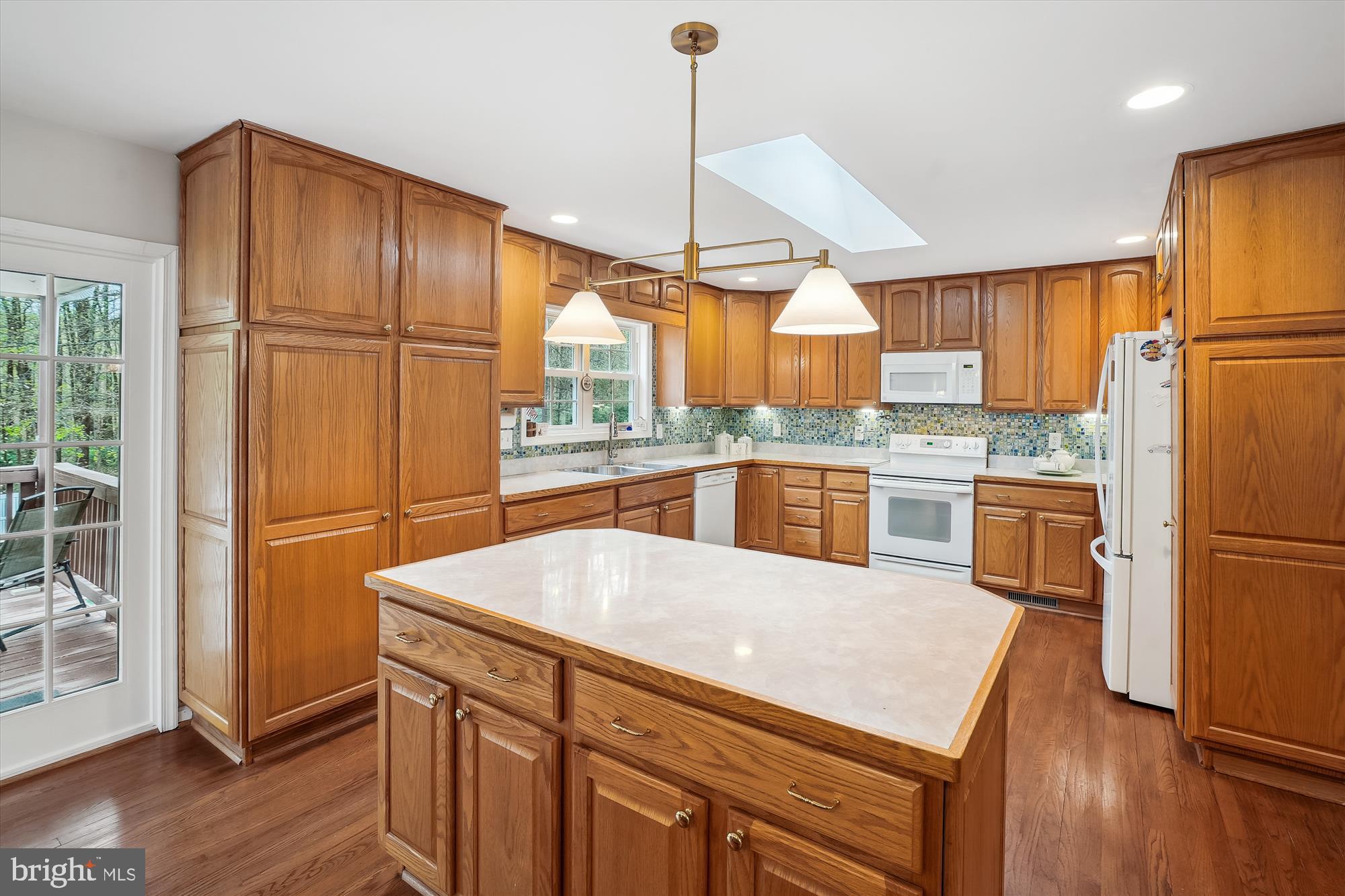 6957 Conservation Drive Springfield, VA 22153 - Photo 15 of 64 Large kitchen island with new light fixture