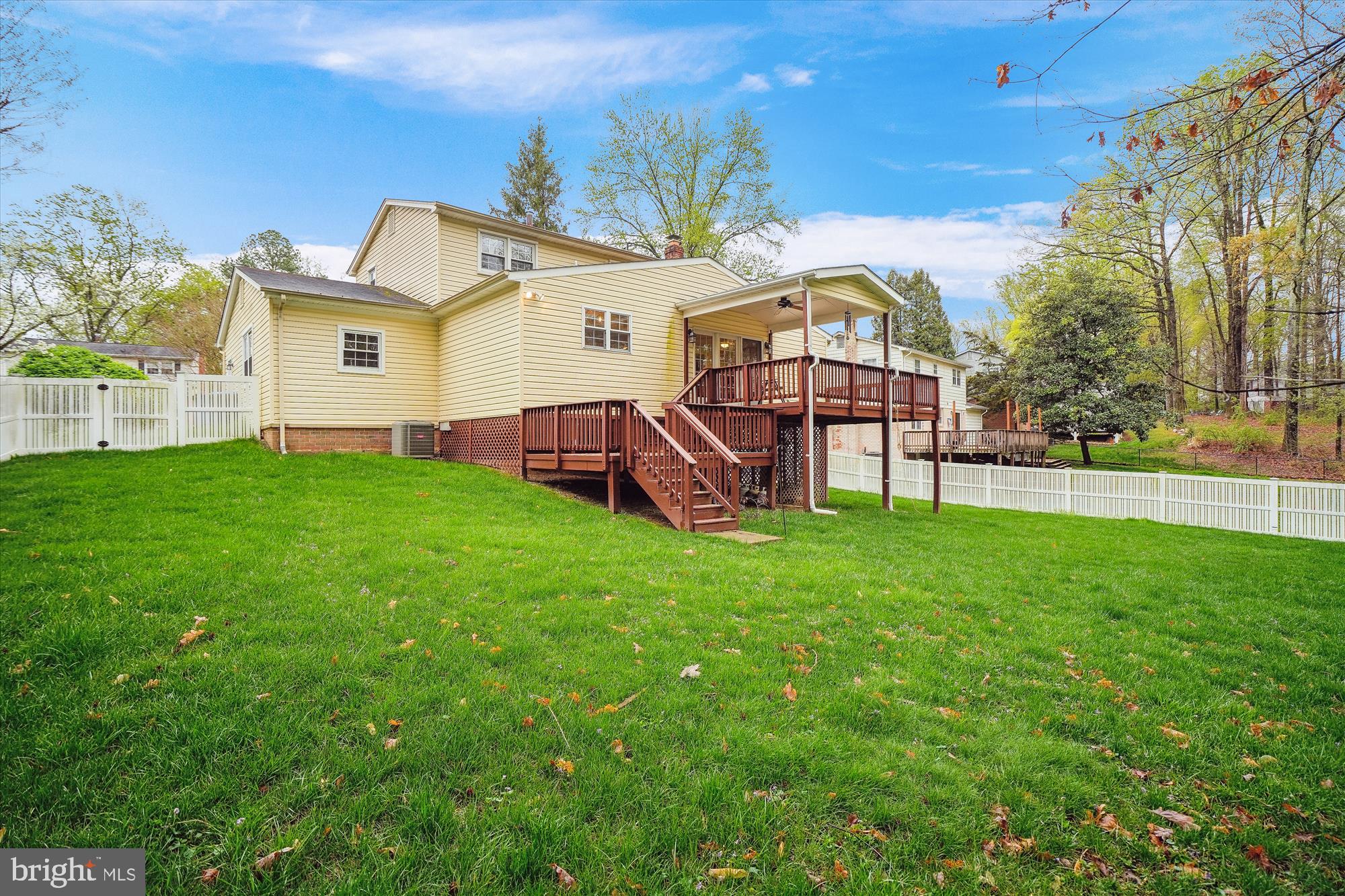 6957 Conservation Drive Springfield, VA 22153 - Photo 2 of 64 a view of a house with a backyard