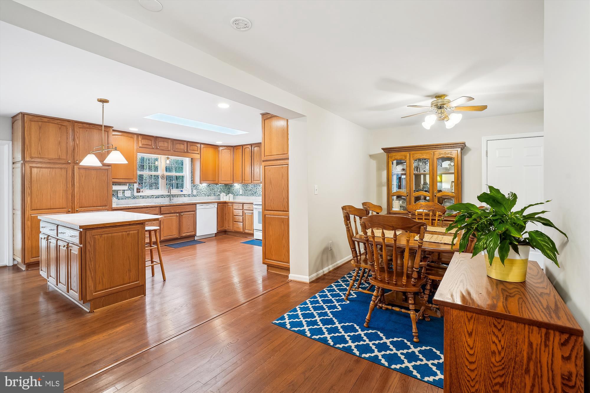 6957 Conservation Drive Springfield, VA 22153 - Photo 20 of 64 a dining room with furniture a window and wooden floor