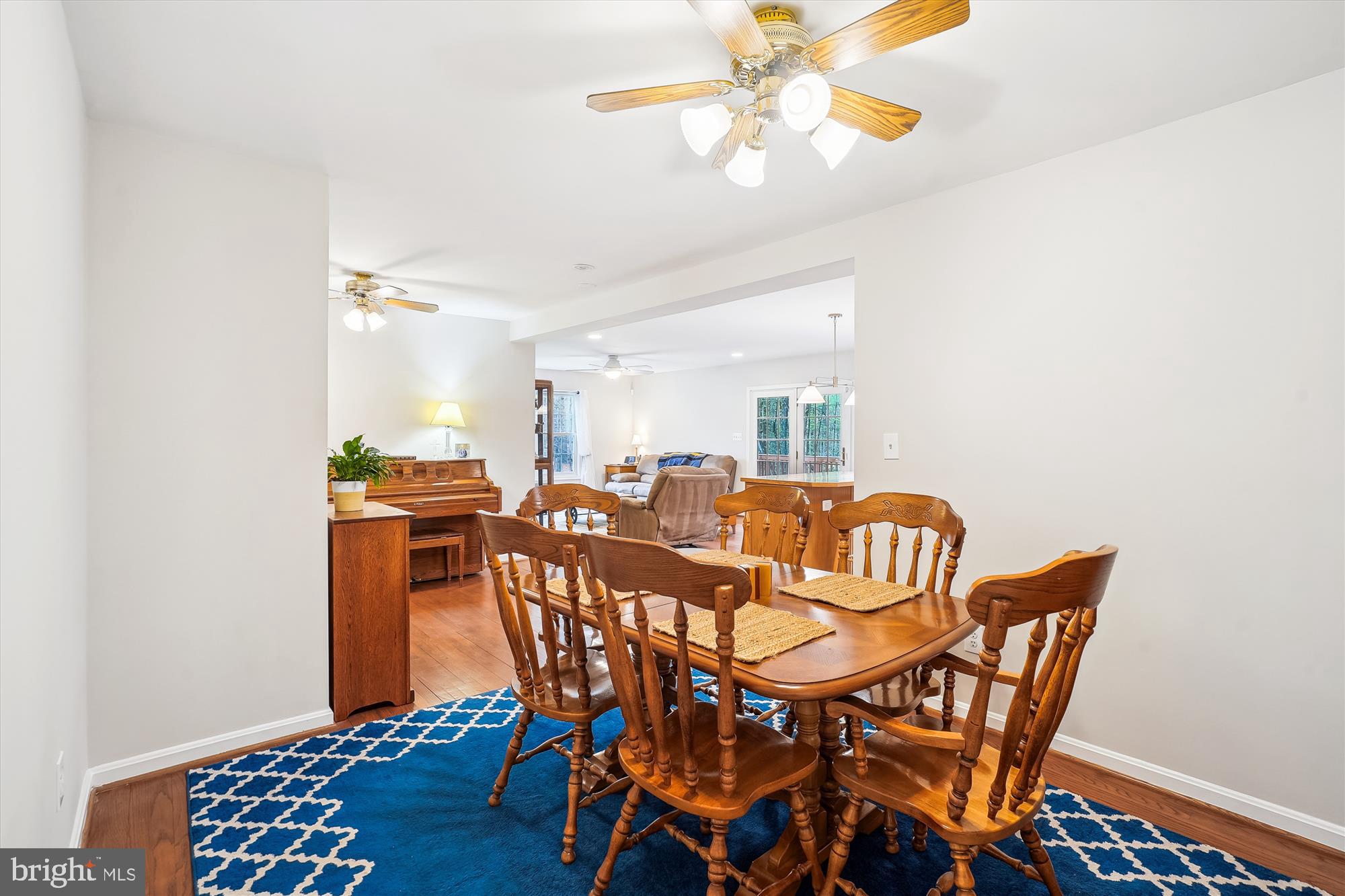 6957 Conservation Drive Springfield, VA 22153 - Photo 21 of 64 a view of a dining room with furniture and wooden floor