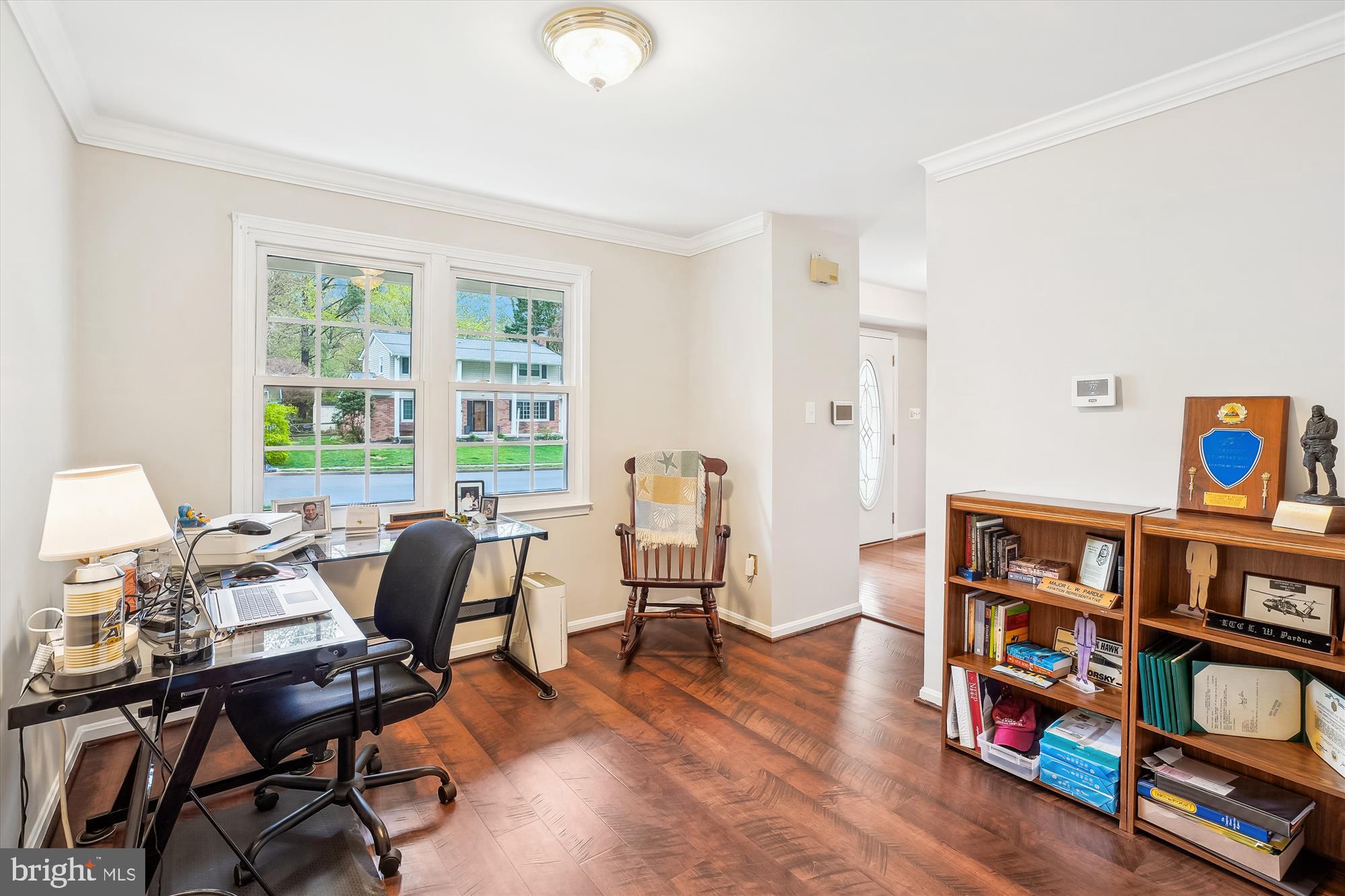 6957 Conservation Drive Springfield, VA 22153 - Photo 24 of 64 a view of a workspace with furniture and a bookshelf