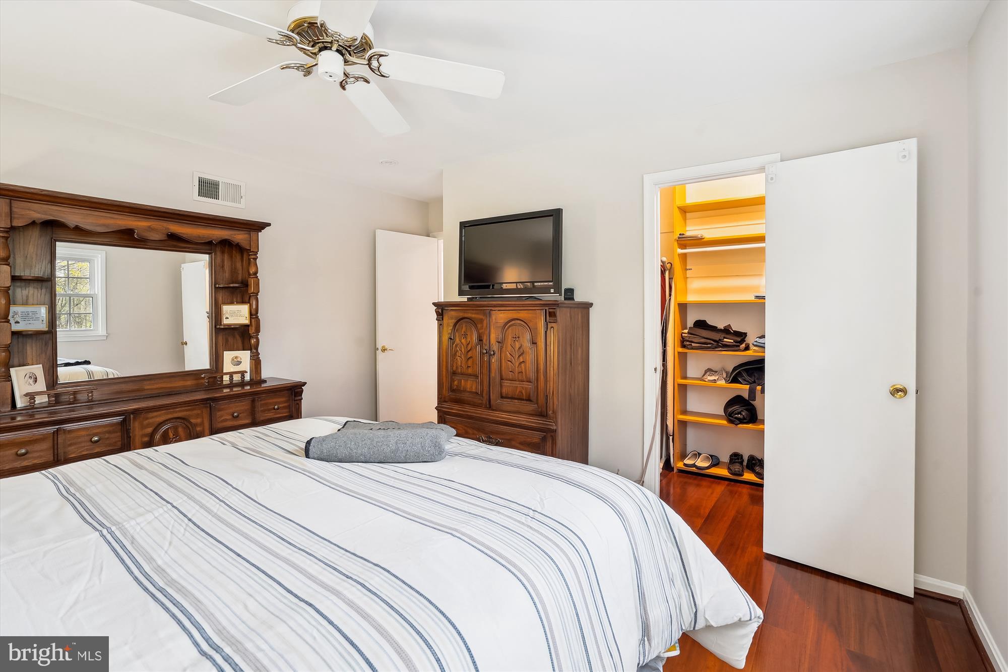 6957 Conservation Drive Springfield, VA 22153 - Photo 30 of 64 a bedroom with a bed and a television