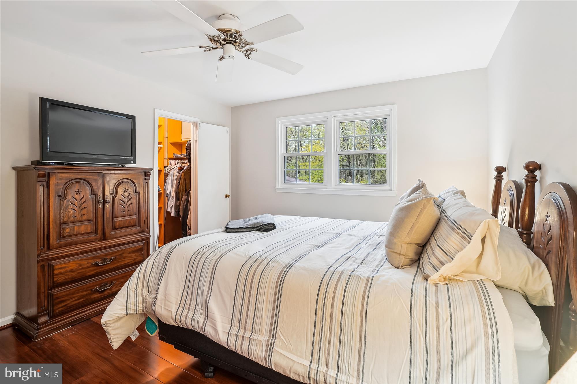 6957 Conservation Drive Springfield, VA 22153 - Photo 31 of 64 a bedroom with a bed and a flat screen tv