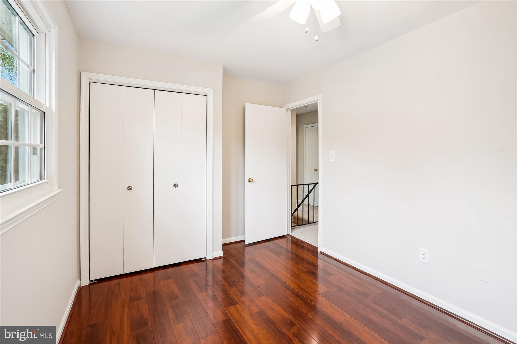 6957 Conservation Drive Springfield, VA 22153 - Photo 35 of 64 a view of an empty room with wooden floor