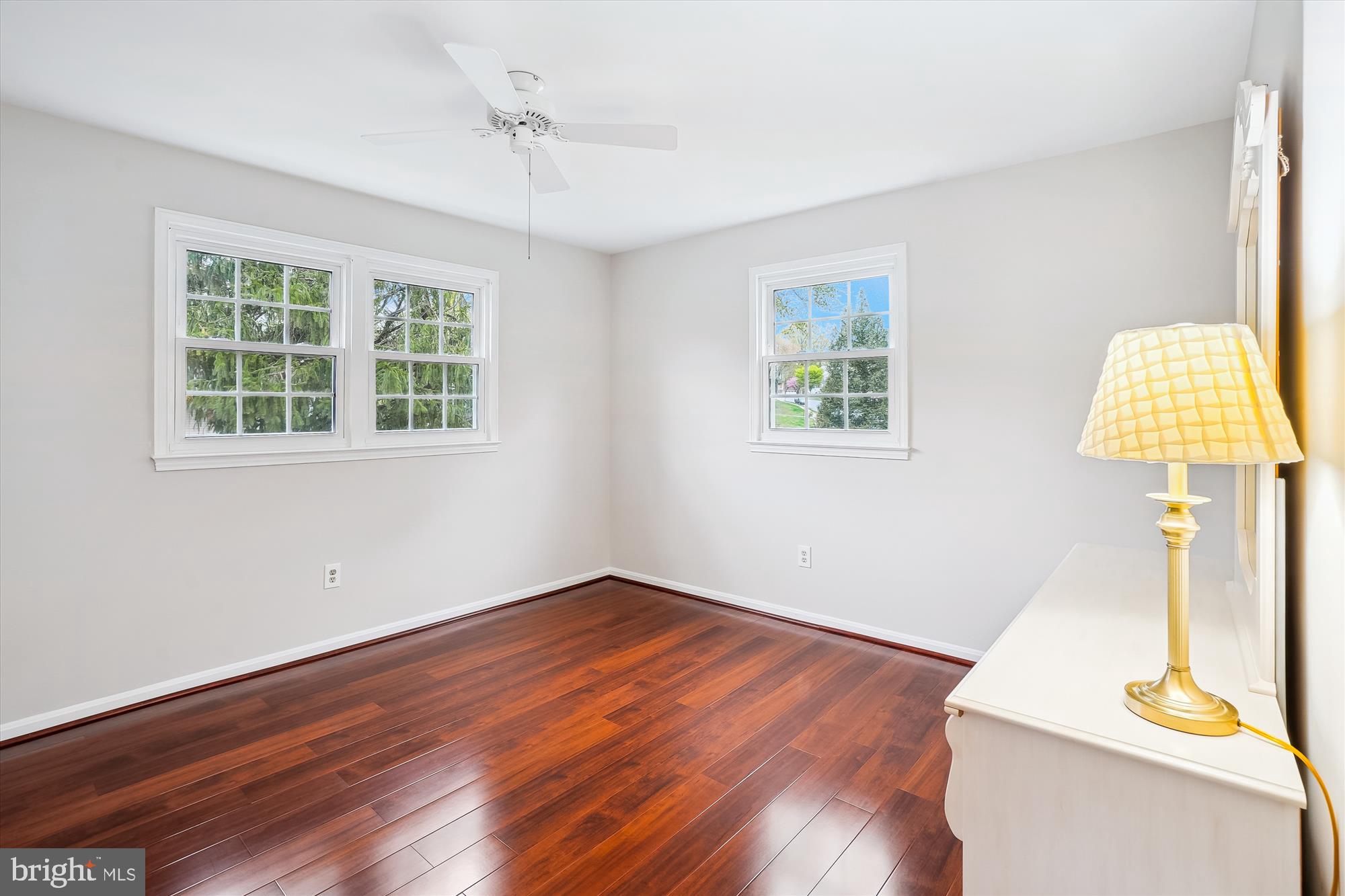 6957 Conservation Drive Springfield, VA 22153 - Photo 38 of 64 a view of an empty room with a window and wooden floor