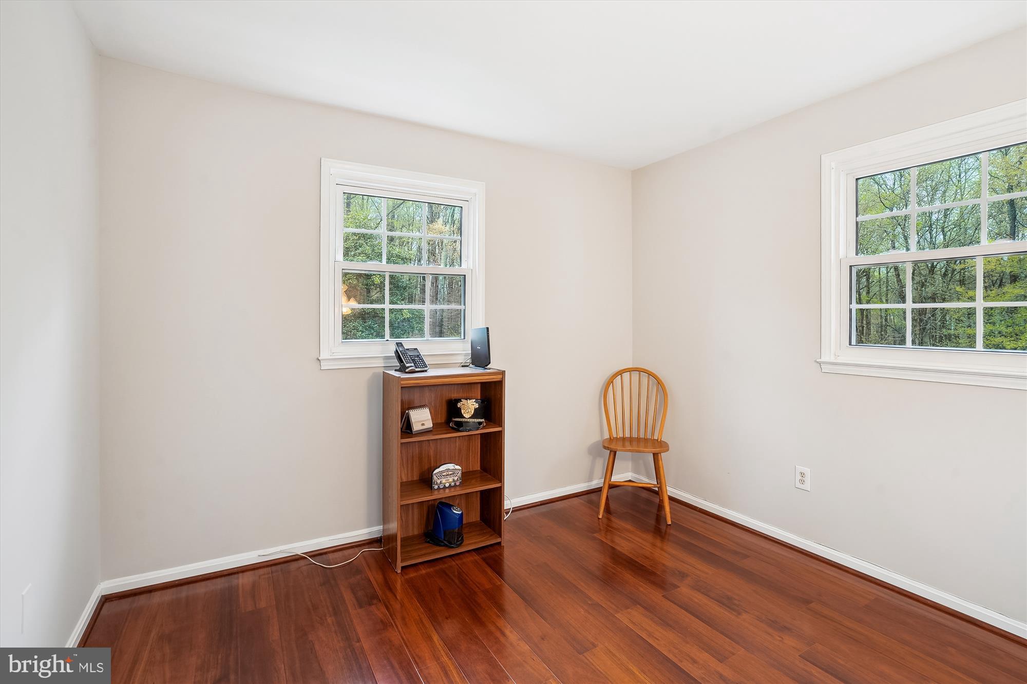 6957 Conservation Drive Springfield, VA 22153 - Photo 42 of 64 a room with a window and wooden floor