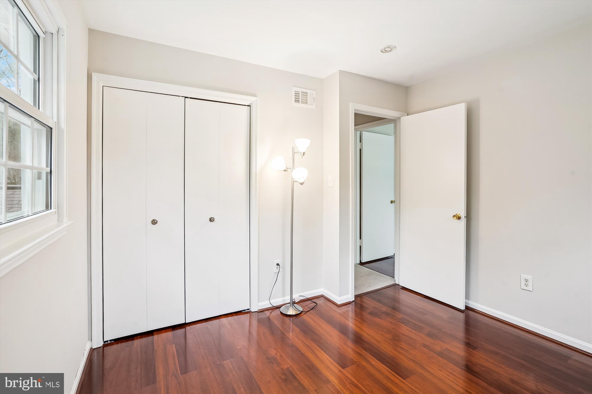 6957 Conservation Drive Springfield, VA 22153 - Photo 45 of 64 a view of an empty room with wooden floor