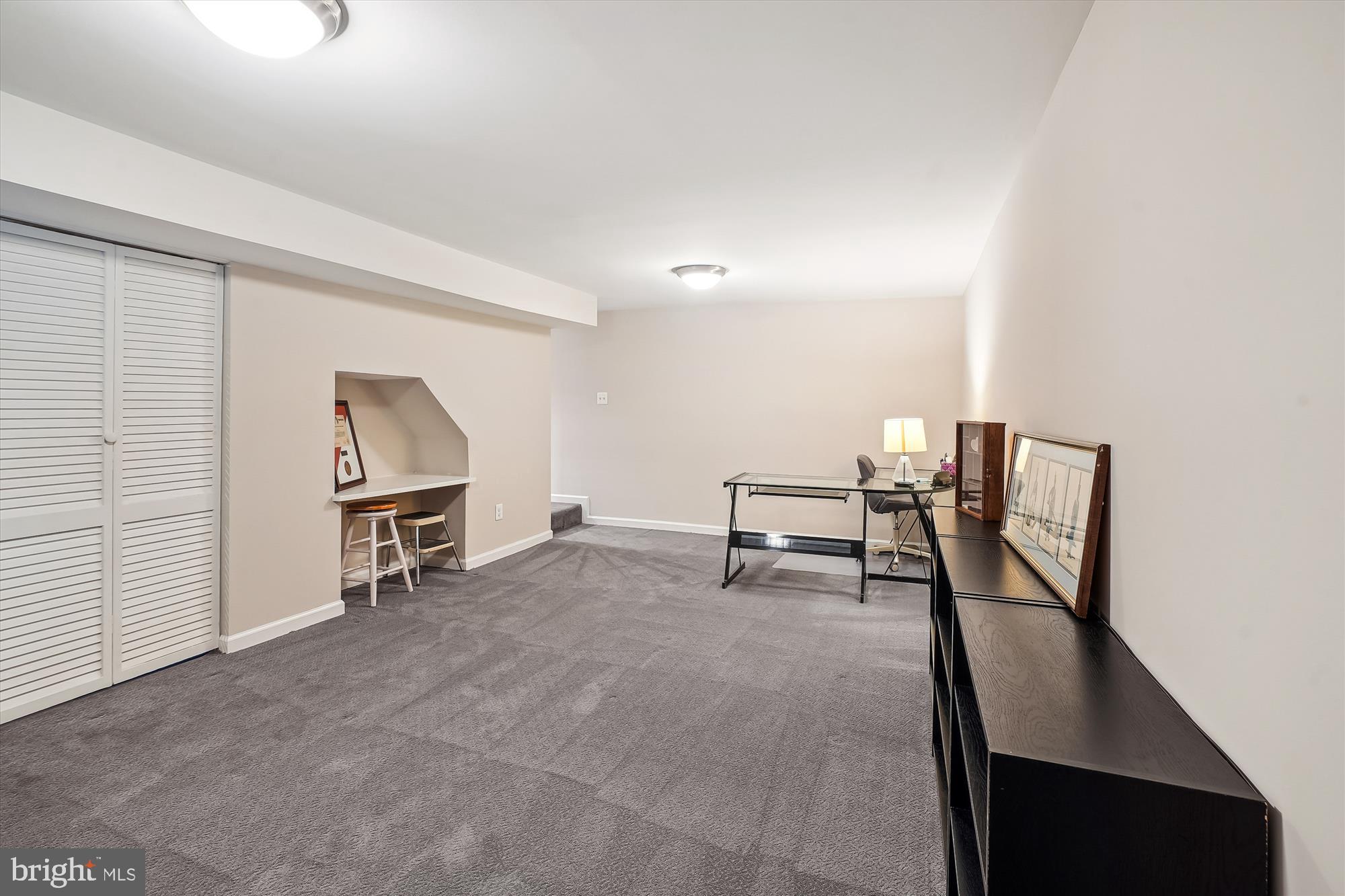 6957 Conservation Drive Springfield, VA 22153 - Photo 48 of 64 a view of a livingroom with furniture and a window