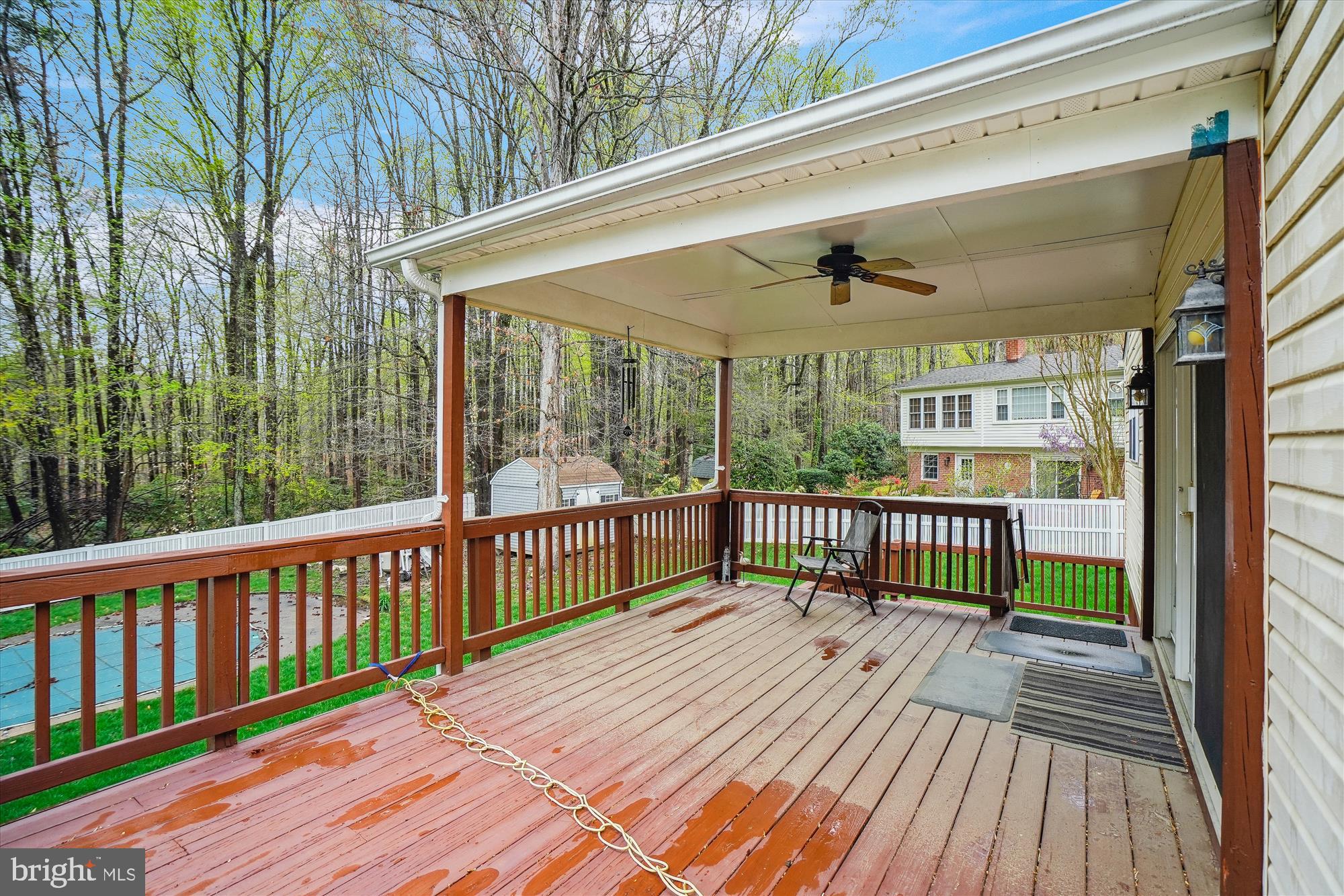 6957 Conservation Drive Springfield, VA 22153 - Photo 59 of 64 Covered deck with outdoor ceiling fan