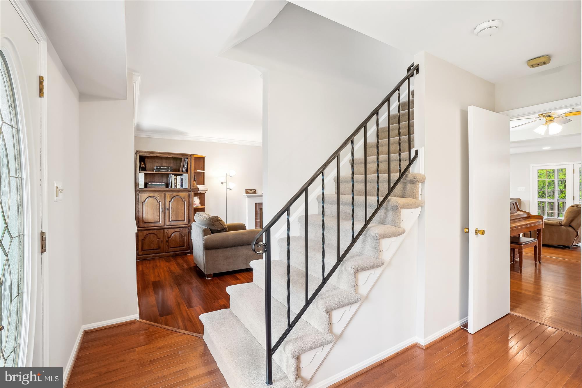 6957 Conservation Drive Springfield, VA 22153 - Photo 6 of 64 a living room with furniture and stairs