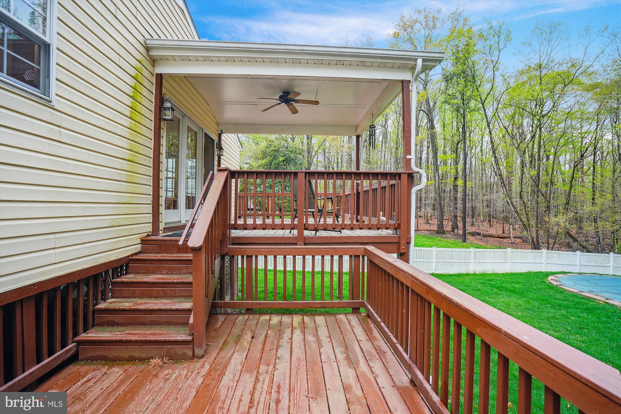 6957 Conservation Drive Springfield, VA 22153 - Photo 60 of 64 a view of a deck with wooden floor and outdoor space