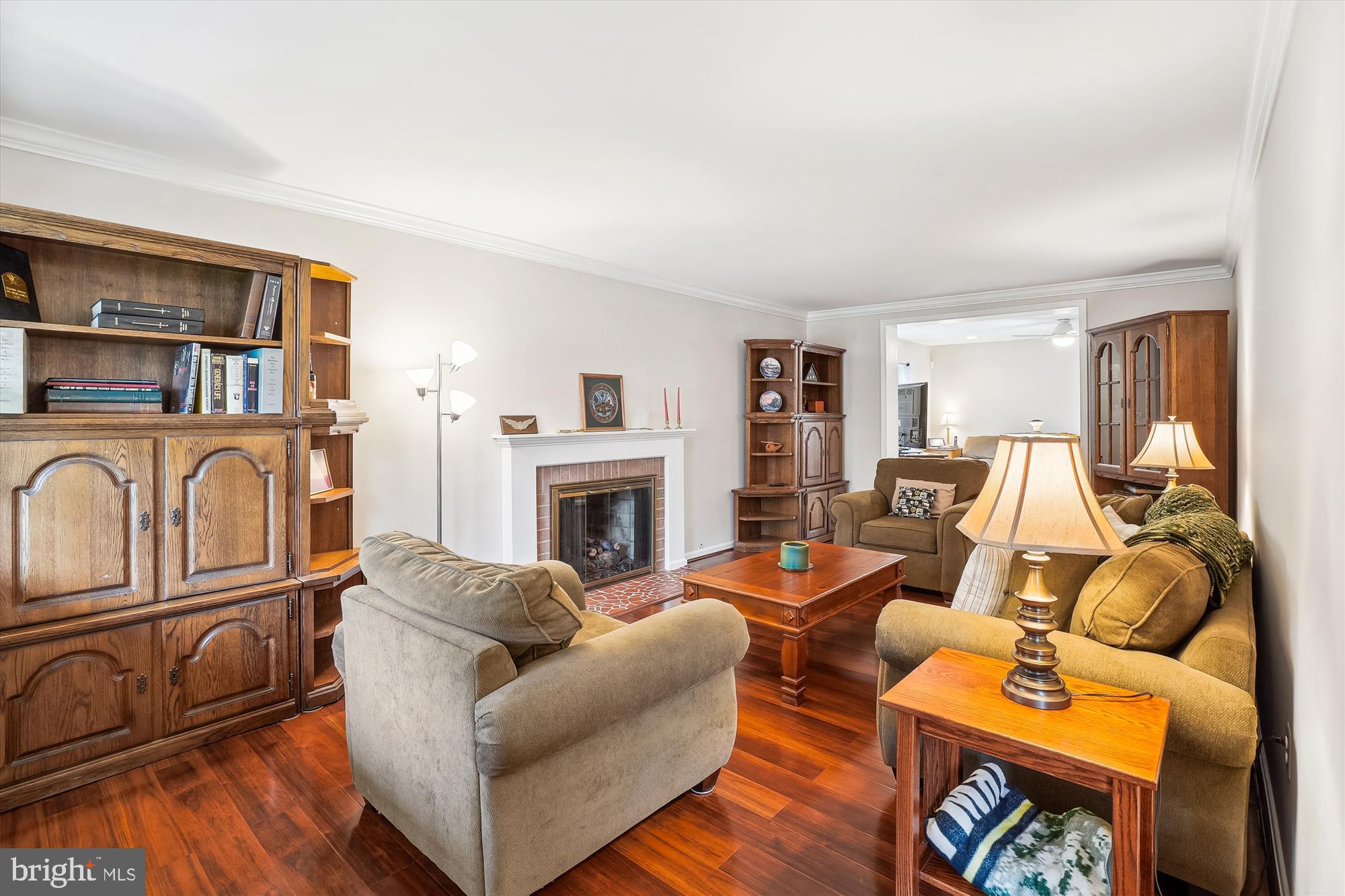 6957 Conservation Drive Springfield, VA 22153 - Photo 7 of 64 a living room with furniture a rug and a fireplace