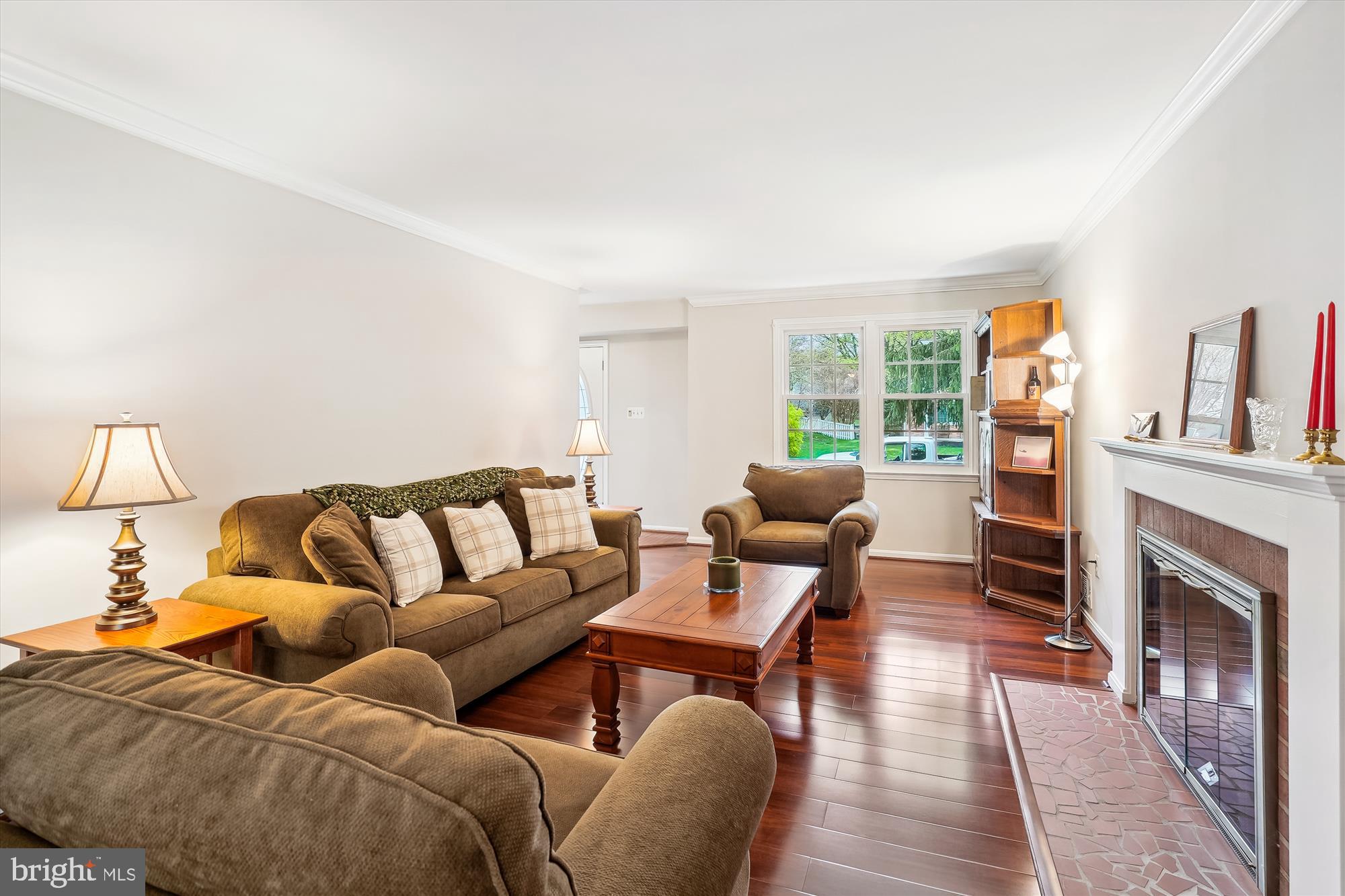 6957 Conservation Drive Springfield, VA 22153 - Photo 9 of 64 a living room with furniture fireplace and a flat screen tv