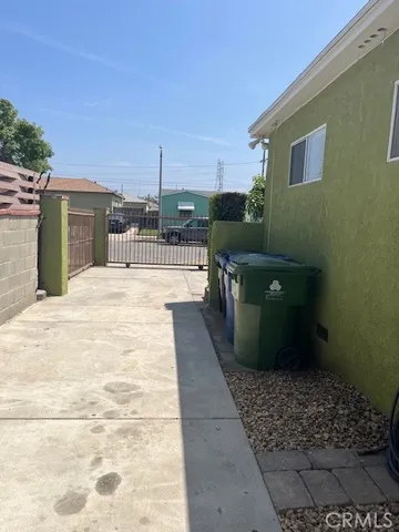 a large kitchen with stainless steel appliances granite countertop a sink and a refrigerator