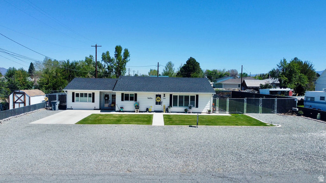 340 West 100 N Street Beaver, UT 84713 - Photo 34 of 37 White single-story residence with a dark shingle roof