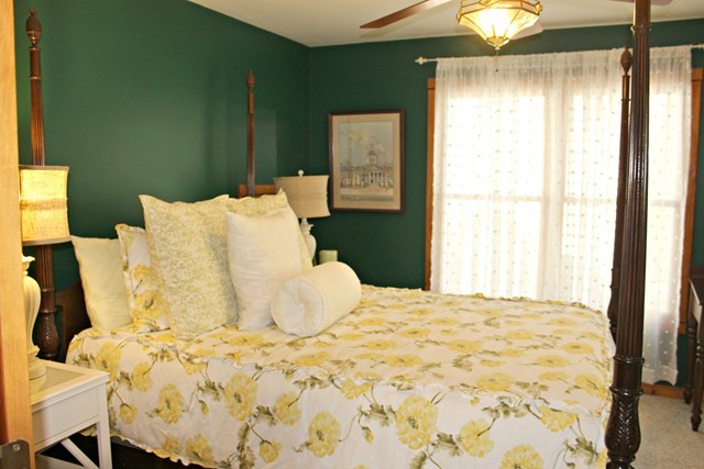 683 Sanders Road Macon, GA 31210 - Photo 11 of 19 a large bed sitting in a bedroom next to a window