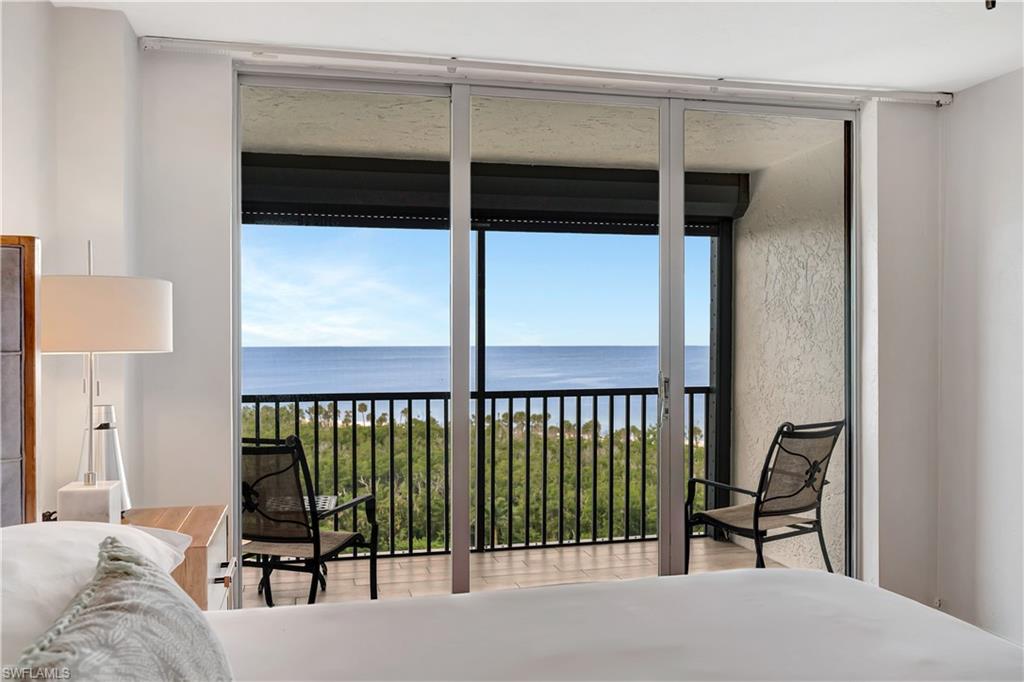 11 Bluebill Avenue, Unit 1101 Naples, FL 34108 - Photo 11 of 40 a view of a bedroom with furniture and a window