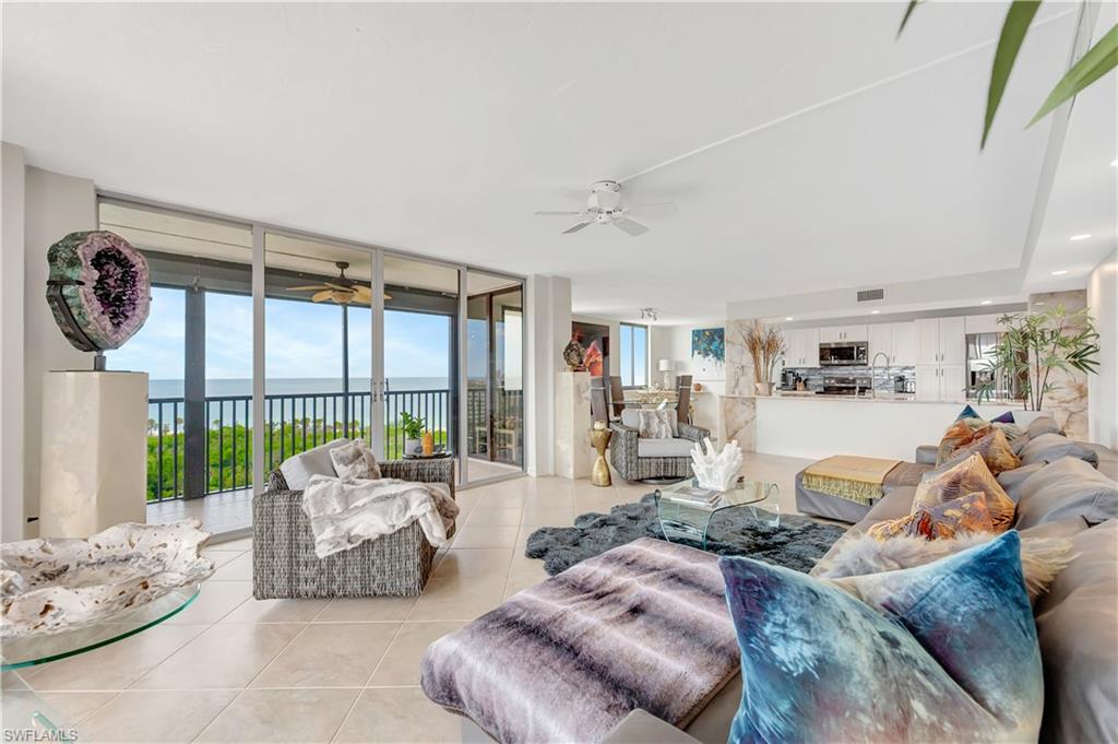 11 Bluebill Avenue, Unit 1101 Naples, FL 34108 - Photo 13 of 40 a living room with furniture and a large window