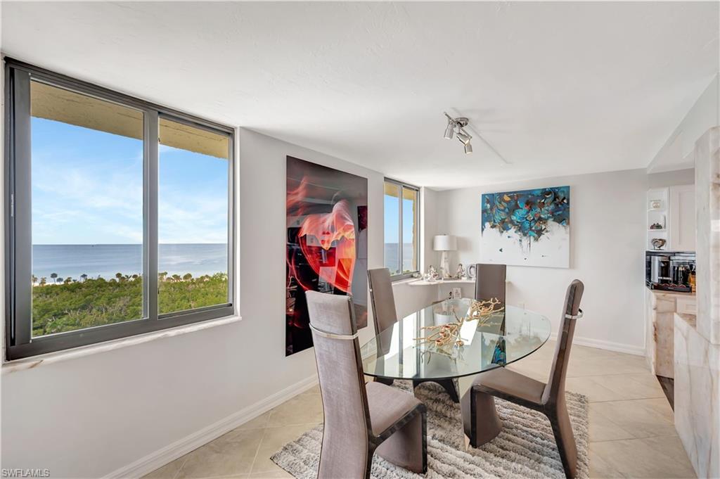 11 Bluebill Avenue, Unit 1101 Naples, FL 34108 - Photo 18 of 40 a view of a dining room with furniture window and outside view