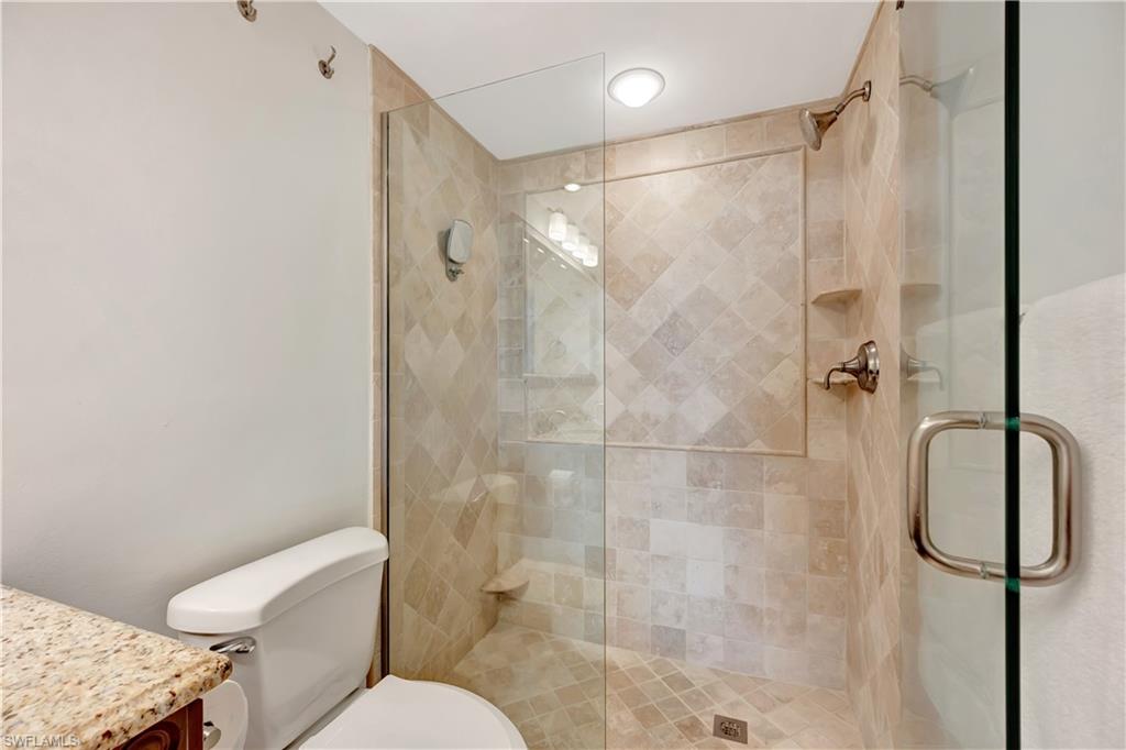 11 Bluebill Avenue, Unit 1101 Naples, FL 34108 - Photo 27 of 40 a bathroom with a shower and toilet