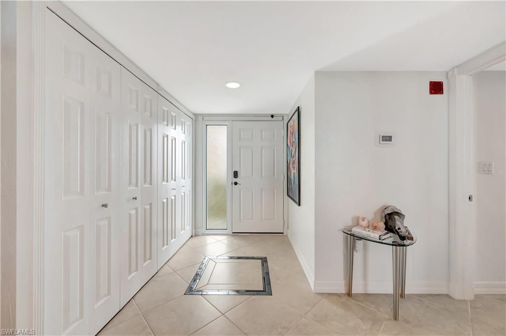 11 Bluebill Avenue, Unit 1101 Naples, FL 34108 - Photo 30 of 40 a view of a hallway with closet area