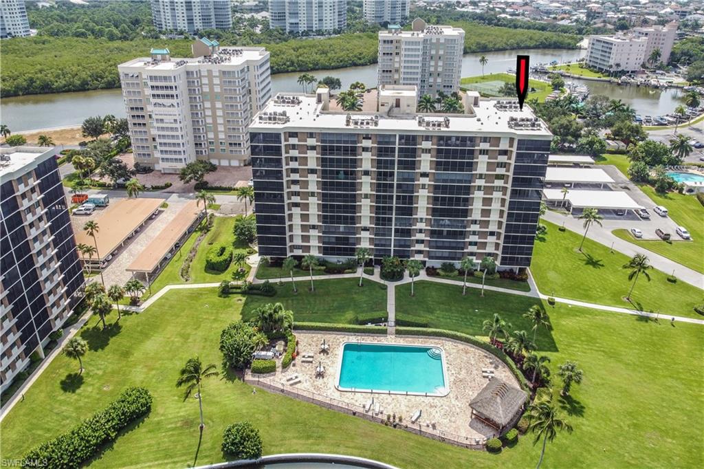 11 Bluebill Avenue, Unit 1101 Naples, FL 34108 - Photo 3 of 40 a view of building with yard