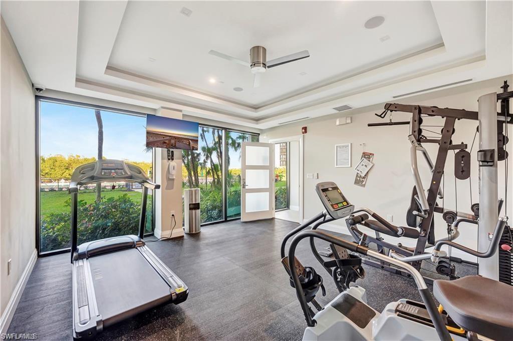 11 Bluebill Avenue, Unit 1101 Naples, FL 34108 - Photo 32 of 40 a view of a room with gym equipment