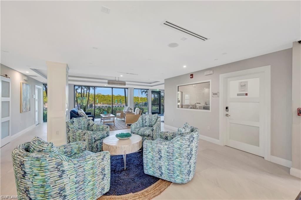 11 Bluebill Avenue, Unit 1101 Naples, FL 34108 - Photo 37 of 40 a living room with furniture and a large window