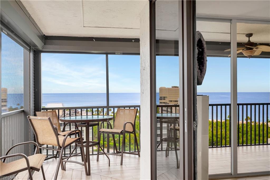 11 Bluebill Avenue, Unit 1101 Naples, FL 34108 - Photo 6 of 40 a view of a chairs and table in balcony