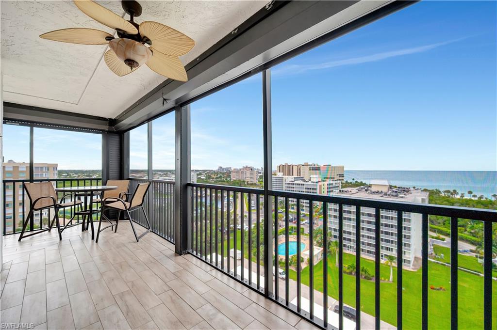 11 Bluebill Avenue, Unit 1101 Naples, FL 34108 - Photo 8 of 40 a balcony with chairs