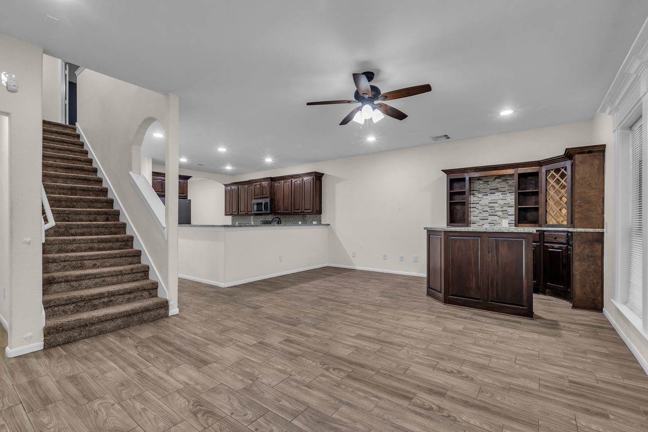 25171 Virginia Lane Porter, TX 77365 - Photo 19 of 39 a view of a livingroom with wooden floor and stairs
