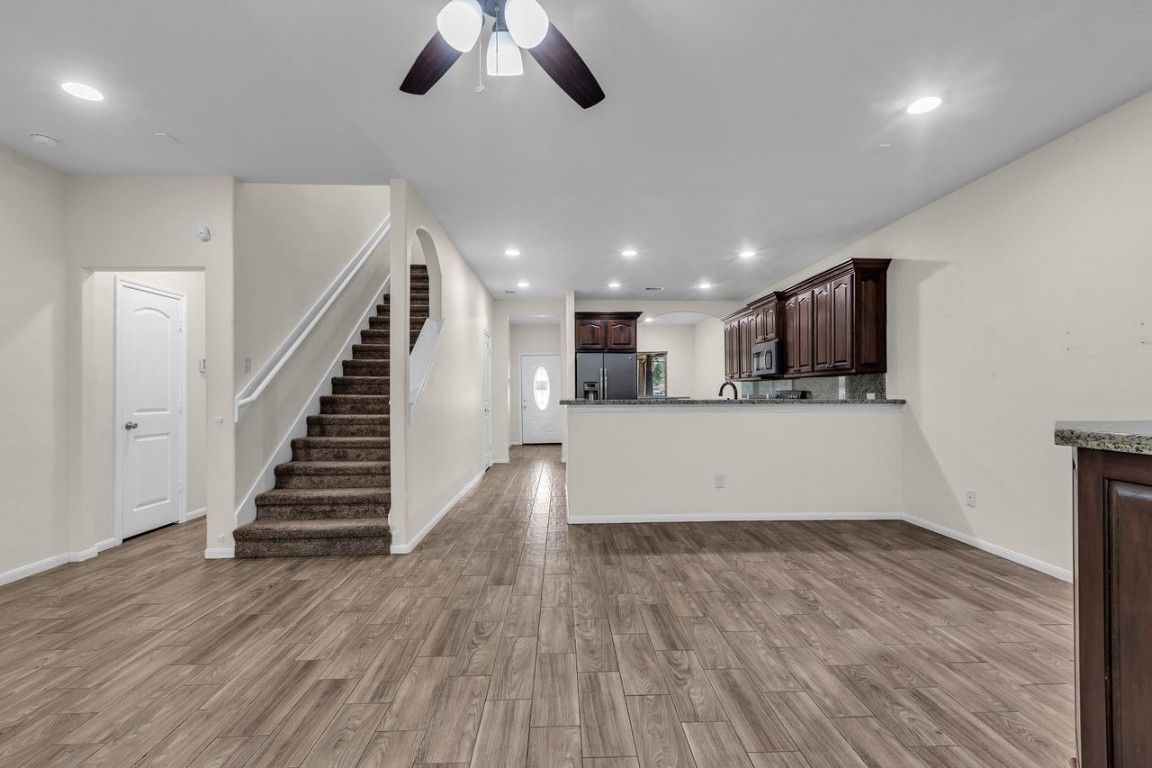 25171 Virginia Lane Porter, TX 77365 - Photo 20 of 39 a view of kitchen and hall with wooden floor