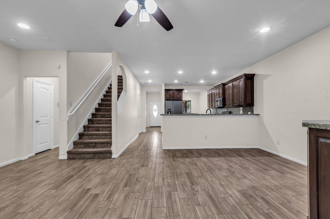25171 Virginia Lane Porter, TX 77365 - Photo 20 of 39 a view of kitchen and hall with wooden floor