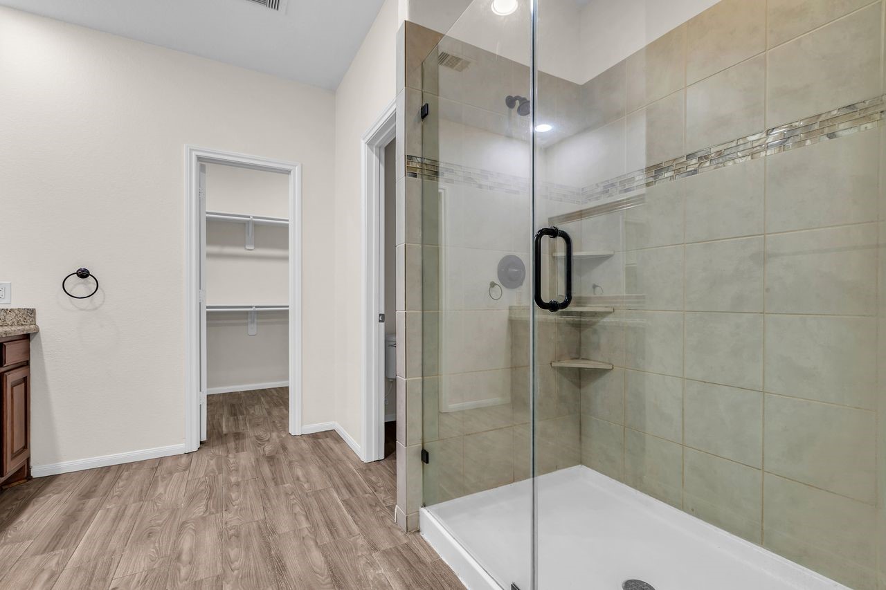 25171 Virginia Lane Porter, TX 77365 - Photo 25 of 39 a bathroom with a shower and a sink