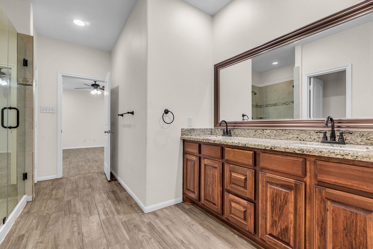 25171 Virginia Lane Porter, TX 77365 - Photo 26 of 39 a bathroom with a sink and a mirror