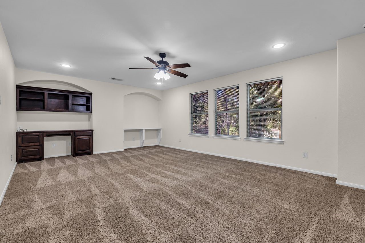 25171 Virginia Lane Porter, TX 77365 - Photo 30 of 39 a view of an empty room with a fireplace and a window