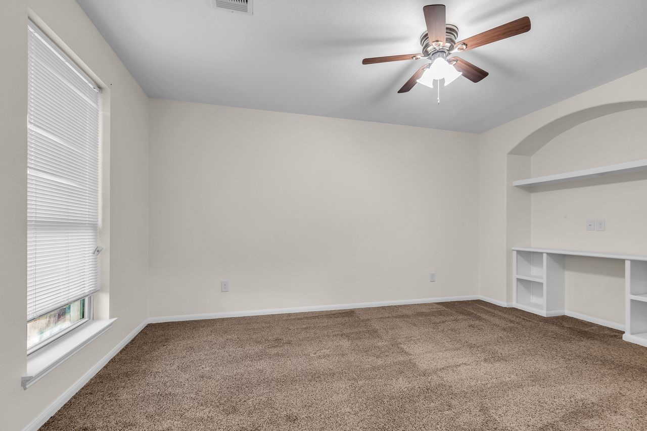 25171 Virginia Lane Porter, TX 77365 - Photo 37 of 39 a view of a big room with chandelier fan and windows