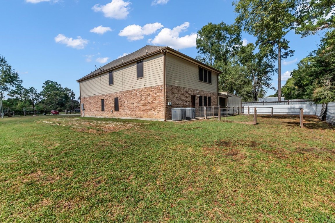 25171 Virginia Lane Porter, TX 77365 - Photo 6 of 39 a view of a house with a yard
