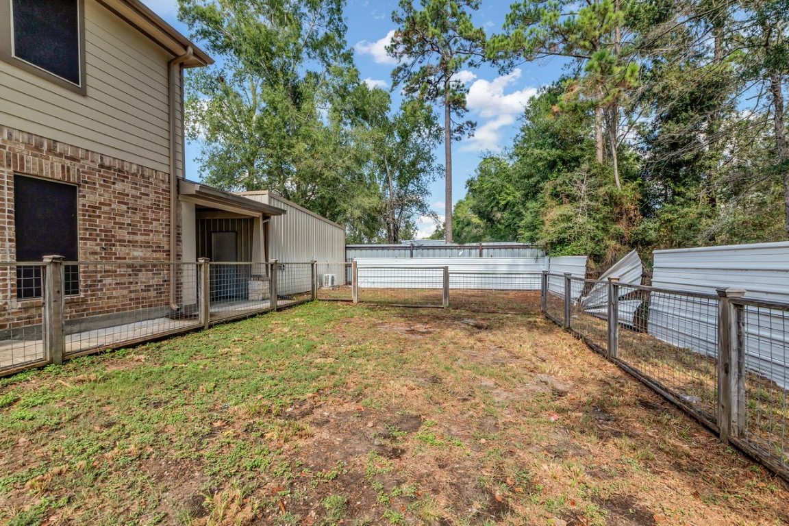 25171 Virginia Lane Porter, TX 77365 - Photo 7 of 39 a view of backyard and entertaining space