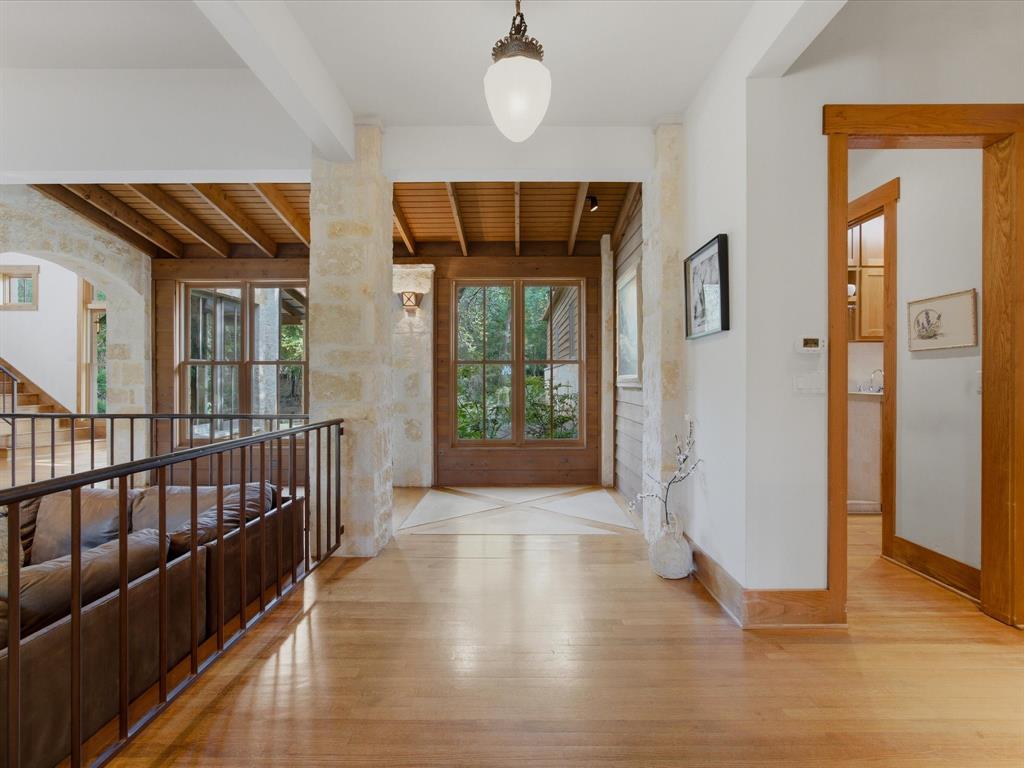 151 Trinity Bluffs Road Aledo, TX 76008 - Photo 10 of 40 a view of a hallway with wooden floor and windows