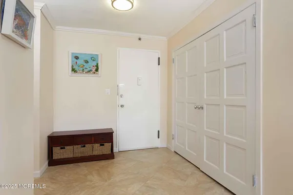 a kitchen with stainless steel appliances kitchen island granite countertop a table chairs sink and cabinets