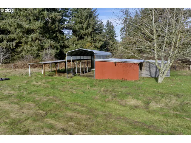 a view of a grassy area with an trees